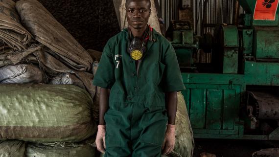 A young man works at a factory