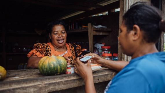A shopkeeper receives an electronic payment from a costumer